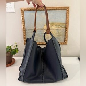 Navy leather bag from The Sak